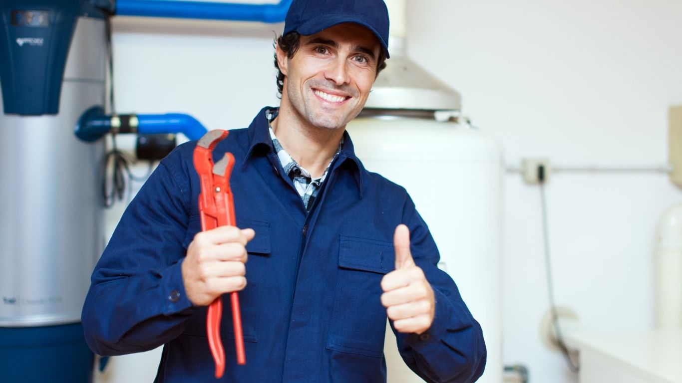 Smiling plumber with thumbs up